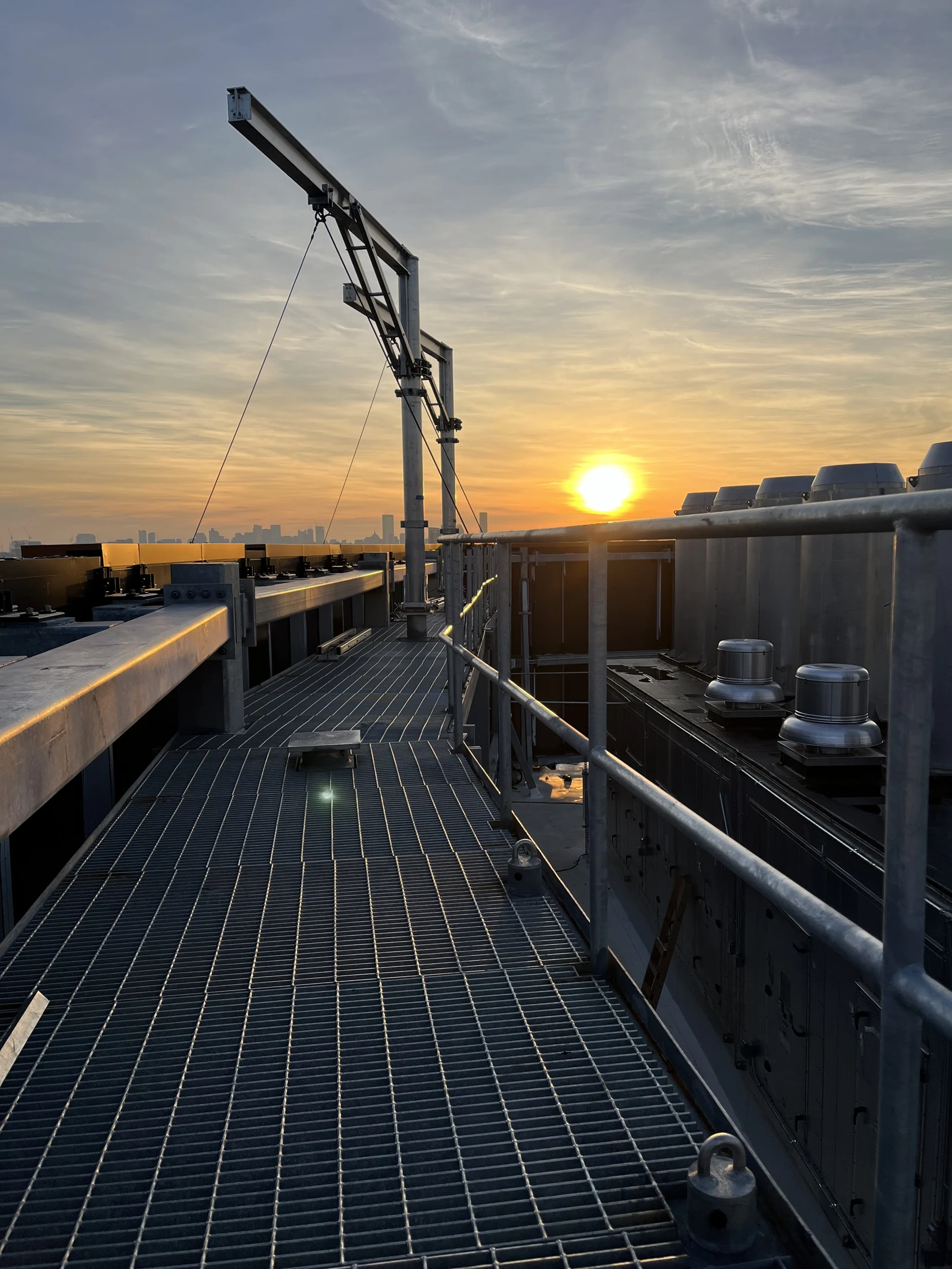 A rooftop davit system in the evening light